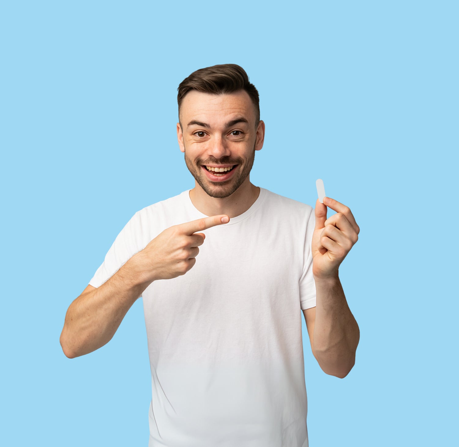 A man confidently pointing to the NozeCalm nosebleed stopper plug, a solution for fast relief.