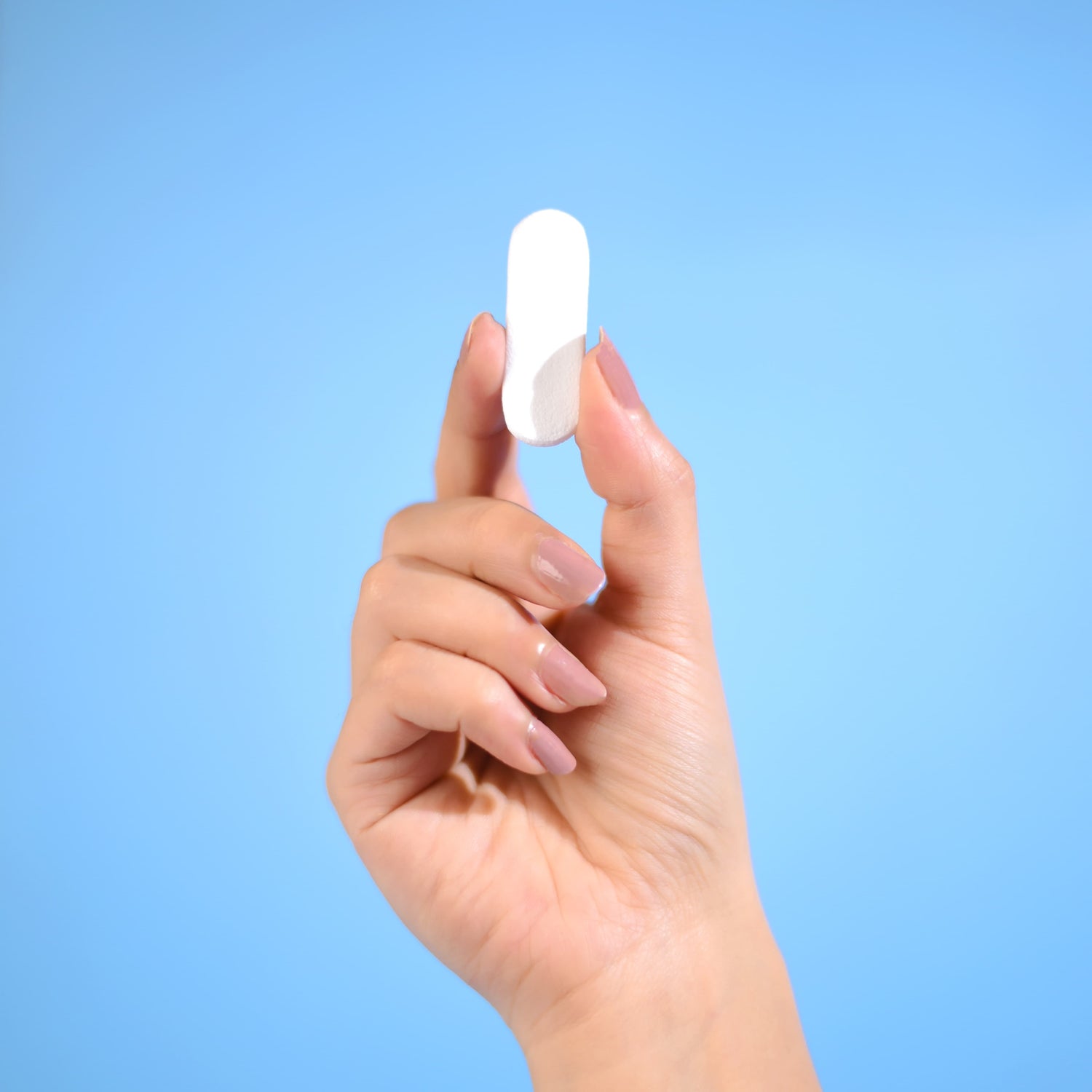 Close-up of the NozeCalm advanced nosebleed stopper showing its size and shape.